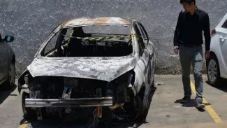 Quelques jours après Noël, les restes calcinés du diplomate avaient été découverts dans une voiture de location carbonisée. FABIO TEIXEIRA / AFP


