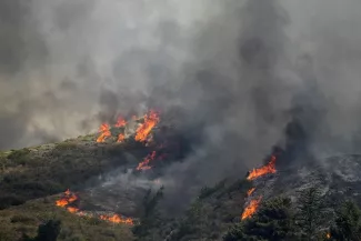 Incendies en Grèce: Des dizaines de touristes sont rentrés en Suisse.