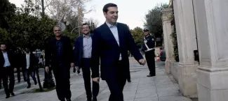 Syriza leader Alexis Tsipras (C) arrives at the Presidential Palace for his civil oath as Greek Prime Minister in Athens on January 26, 2015. AFP PHOTO / ANGELOS TZORTZINIS


